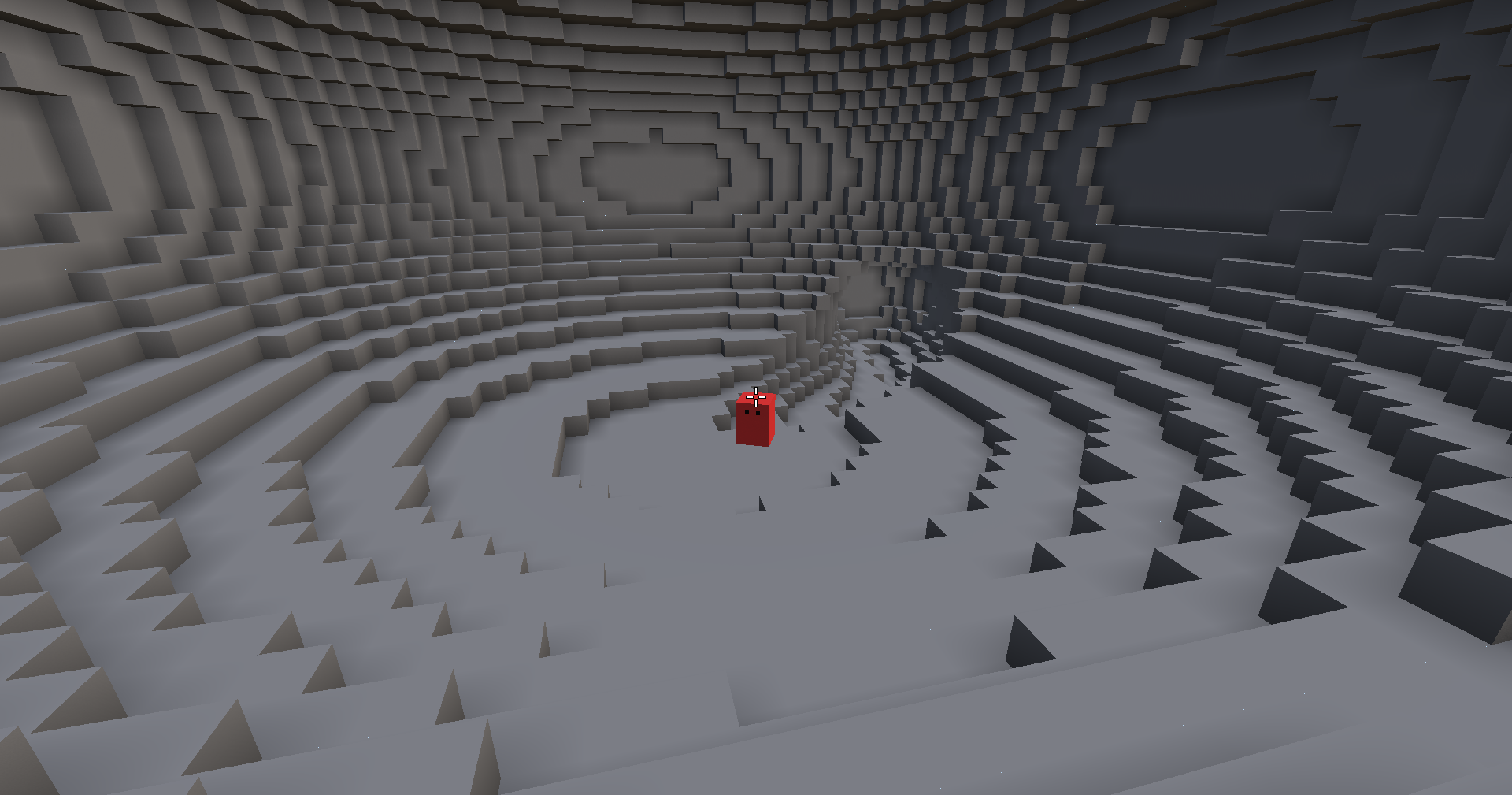 The player stands small in the middle of a wide stone chamber whose walls and floor step away in rings.