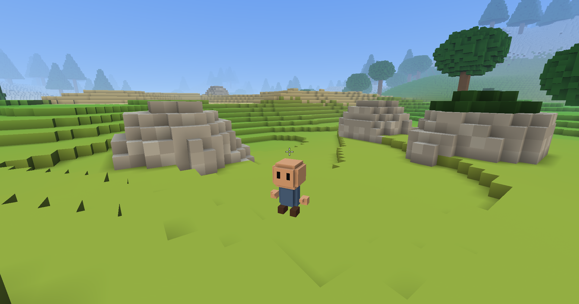 The player faces the camera on a grassy rise, with three rounded grey limestone boulders sunk into the ground around them and an oak growing beyond the nearest, under a hazy sky with pines on far hills.
