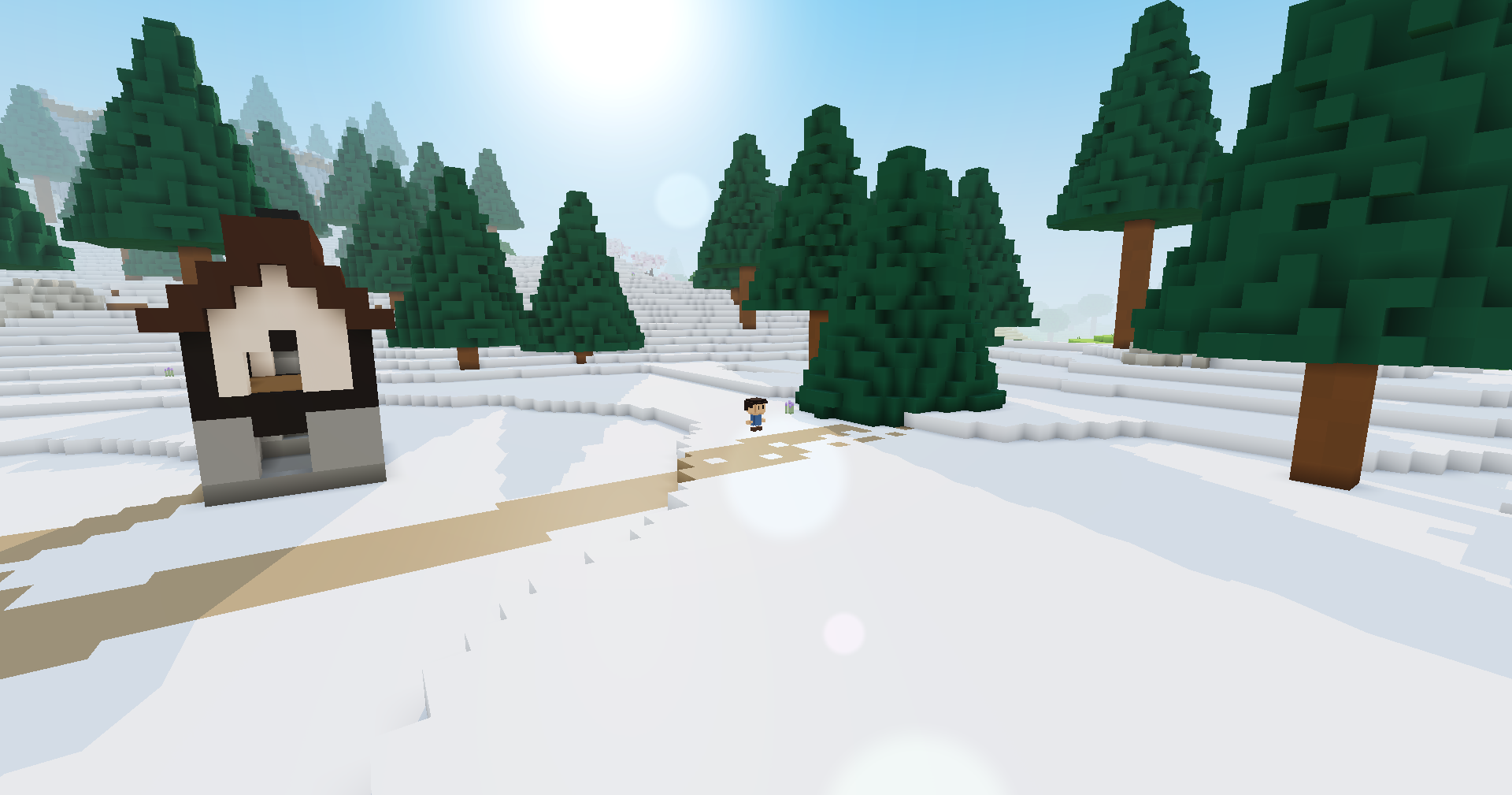 Snowy ground in a town under the sun, with its lens flare: a house and pines cast block-edged shadows toward the camera across the snow and a dirt path, and a villager stands in the middle distance.