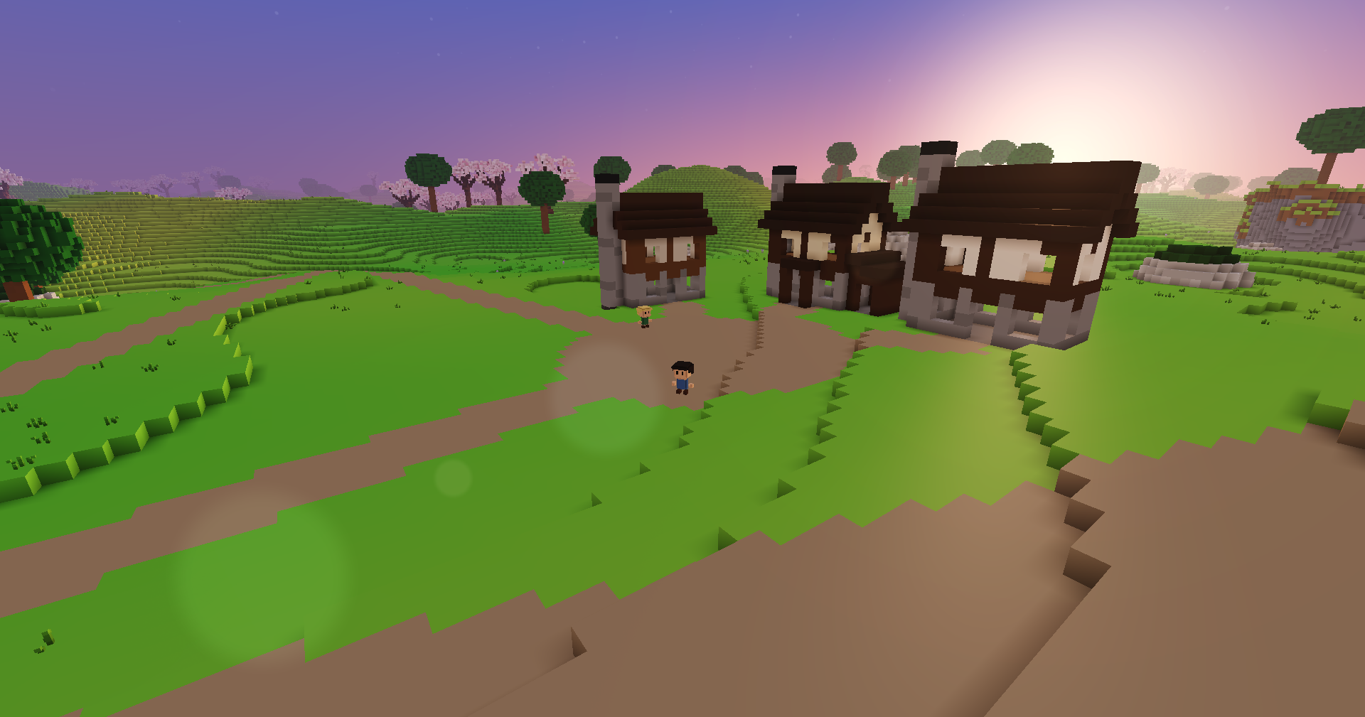 Three timbered houses at sunset under a purple and pink sky, the sun low behind them, the ground beneath them now without shadows.